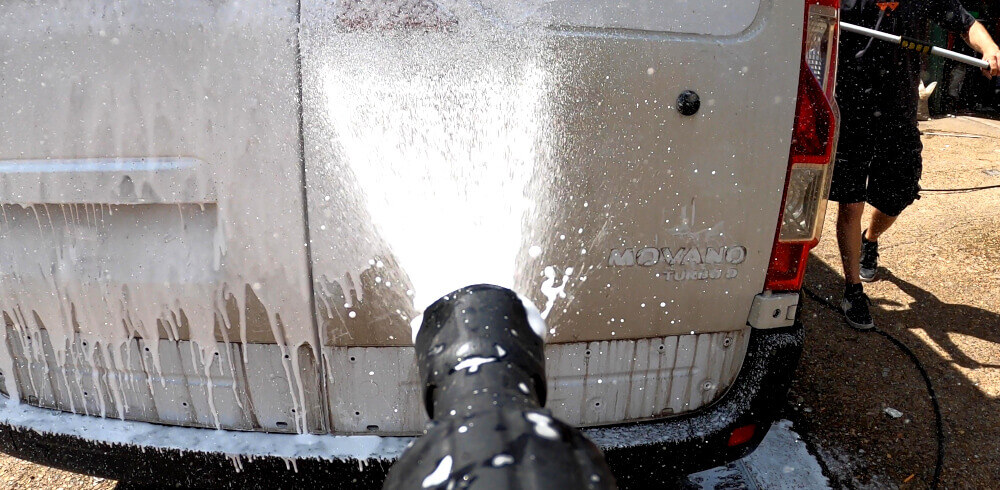 Jet washing a van after unwrapping the vehicle